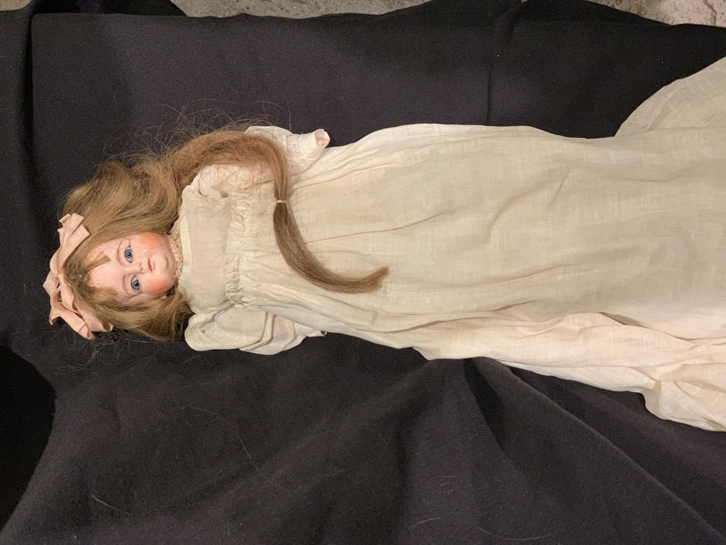 The creepiness factor of this doll is enhanced by its real human hair.