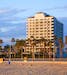 The Waterfront Beach Resort, a Hilton hotel in Huntington Beach, Calif. Hilton Hotels & Resorts has announced it will penalize guests who cancel reser