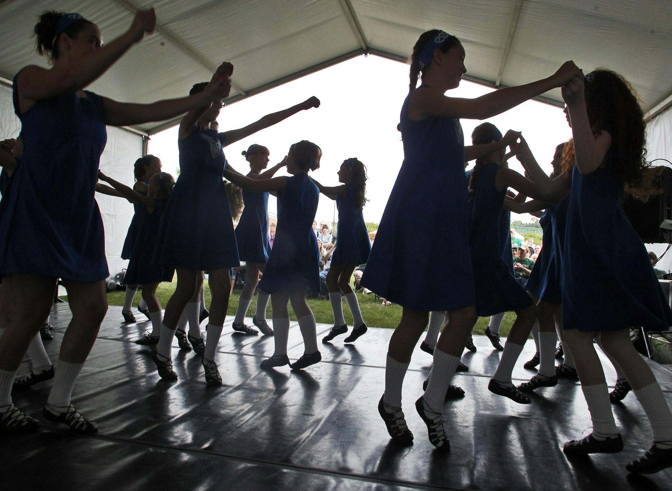 The Irish Fair of Minnesota opened Friday with multiple venues on Harriet Island in St. Paul. Irish dancing, fiddling, rugby and ethnic food are on display. Here the St. Paul Irish Dancers performed. It's a club of 50 dancers ages five to twenty-two that will be performing 15 shows at the fair this weekend. ](MARLIN LEVISON/STARTRIBUNE ) mlevison@startribune.com ORG XMIT: MIN2013080511040224