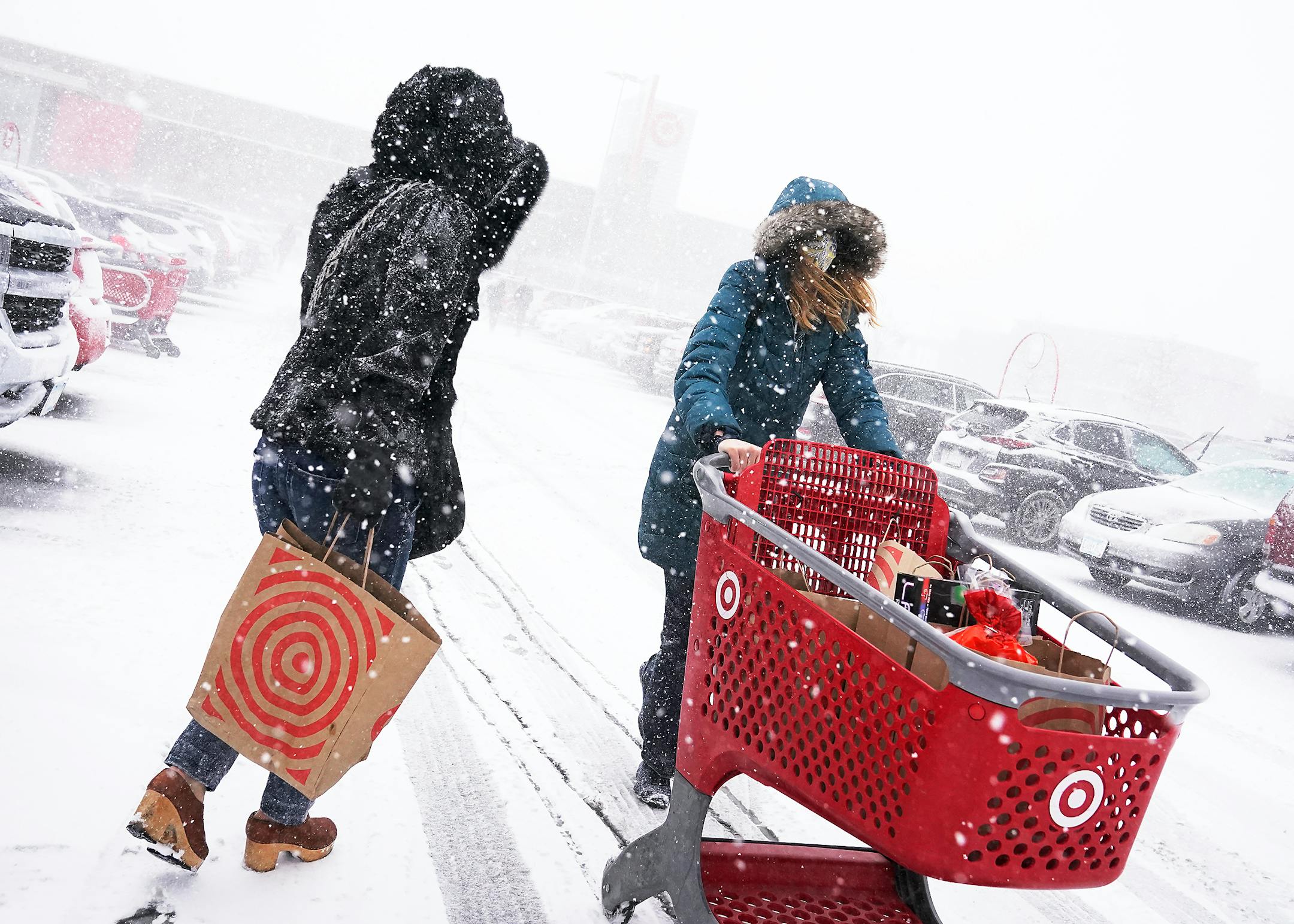 Shoppers endured blizzard conditions while shopping for groceries before the holidays Wednesday the Super Target in Richfield.