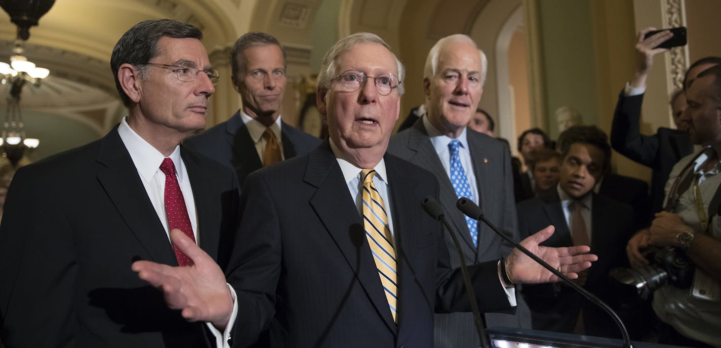 Senate Majority Leader Mitch McConnell of Ky., joined by, from left, Sen. John Barrasso, R-Wyo., Sen. John Thune, R-S.D., and Majority Whip John Cornyn, R-Texas, speak with reporters on Capitol Hill in Washington, Tuesday, July 25, 2017, after Vice President Mike Pence broke a 50-50 tie to start debating Republican legislation to tear down much of the Obama health care law. (AP Photo/J. Scott Applewhite) ORG XMIT: MIN2017072515223554