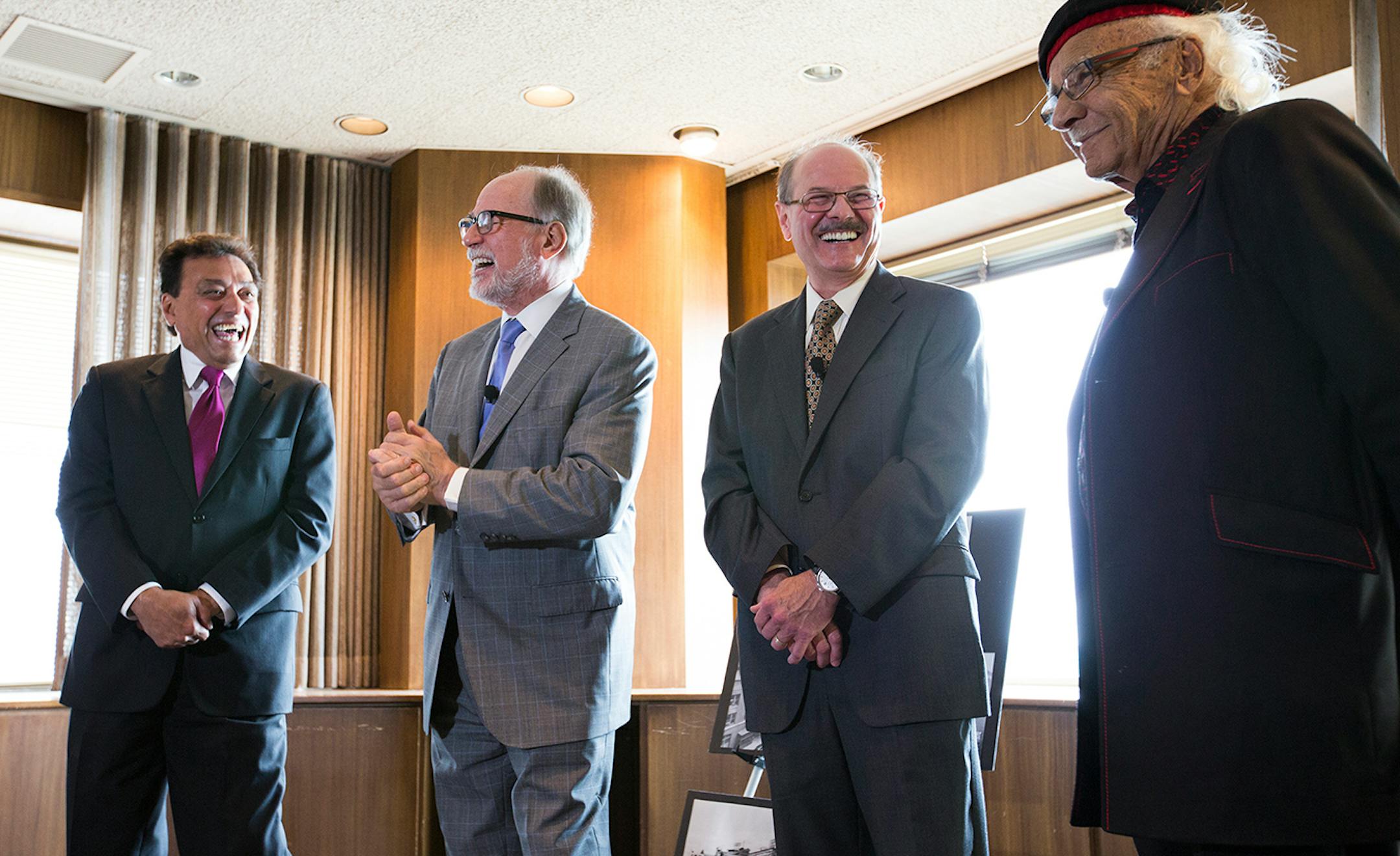 Ramsey County Commissioner Rafael Ortega, from left, Vance Opperman and Fane Opperman, sons of longtime West Publishing president Dwight Opperman, and John Nasseff, local philanthropist who started his career at West Publishing, talk to the press inside the former West Publishing building in downtown St. Paul on Friday, May 29, 2015.