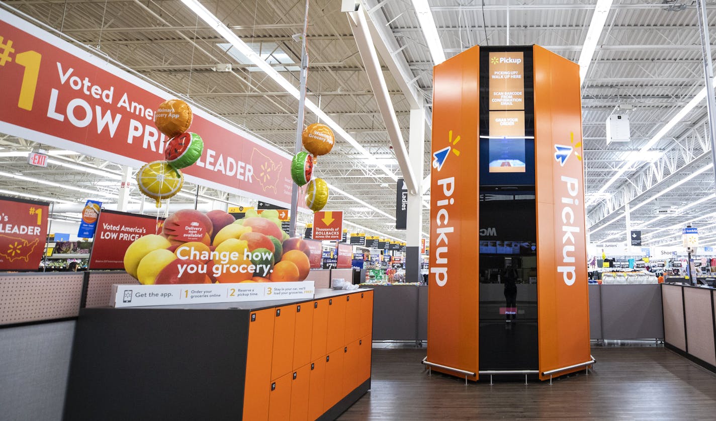 The pickup tower in the Bonney Lake Walmart is a tall, newly installed orange beacon, beckoning online shoppers to unlock their purchases inside. It's manually loaded by Walmart crew members after a shopper places an order. Larger orders are placed in the lockers to the left or kept in the back. The tower activates upon approach and opens when the shopper scans their mobile device. The upgrades are part of a $36 million investment in new technologies and upgrades to Walmarts in Washington state