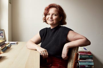 photo of author Madeleine Gray at a desk