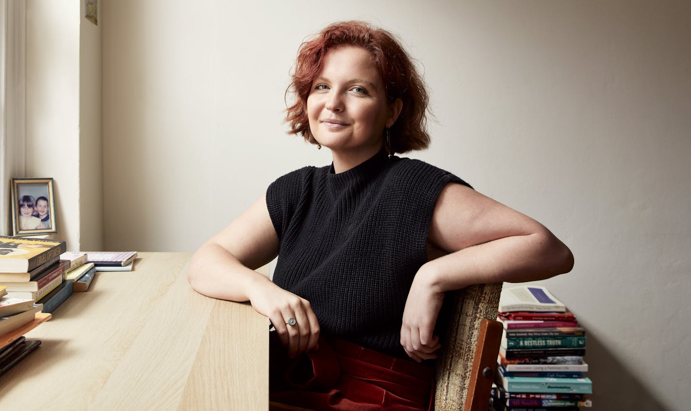 photo of author Madeleine Gray at a desk