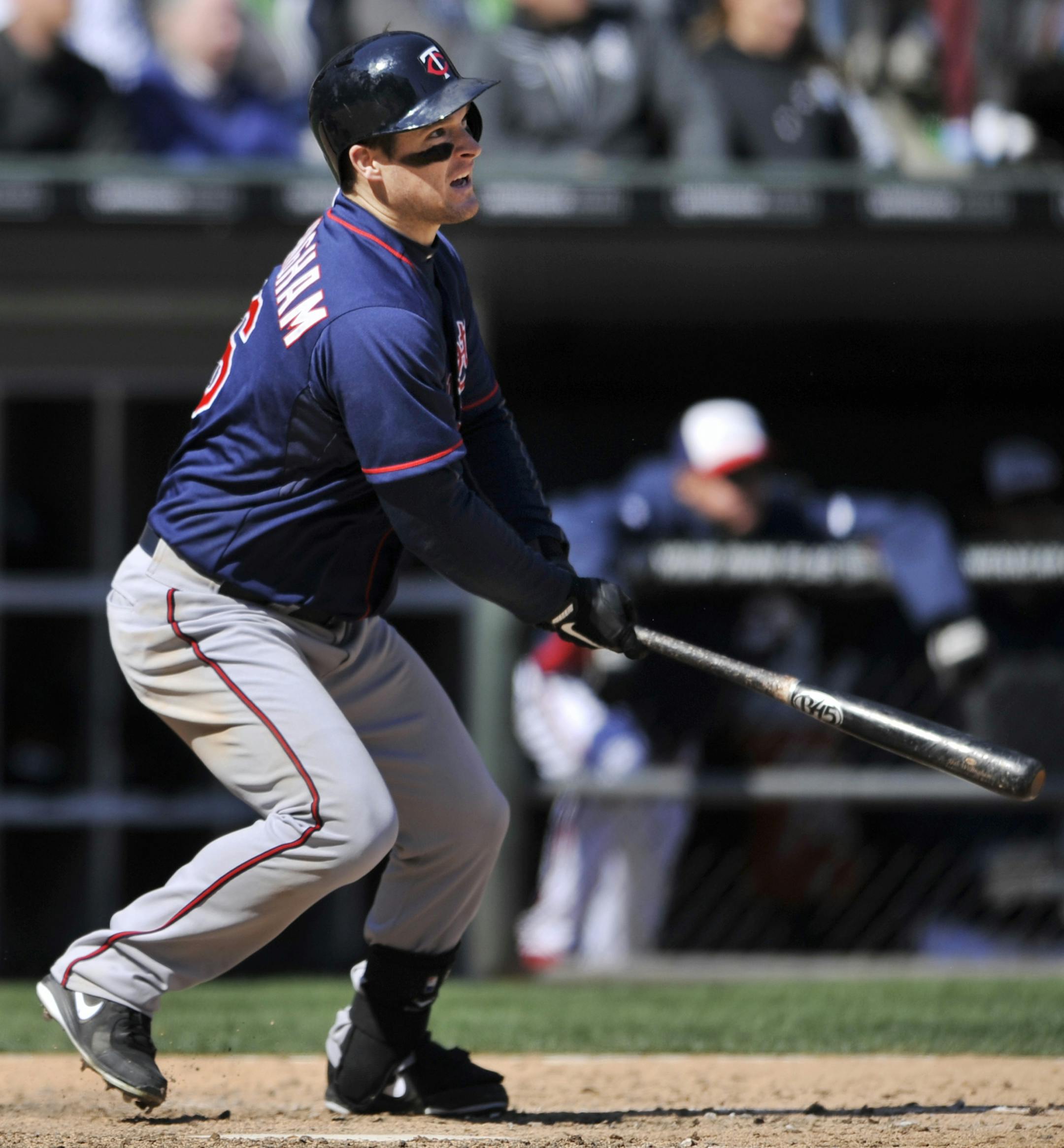 Minnesota Twins' Josh Willingham watches his three-RBI double during the seventh inning of baseball game against the Chicago White Sox in Chicago, April 21, 2013. (AP Photo/Paul Beaty)