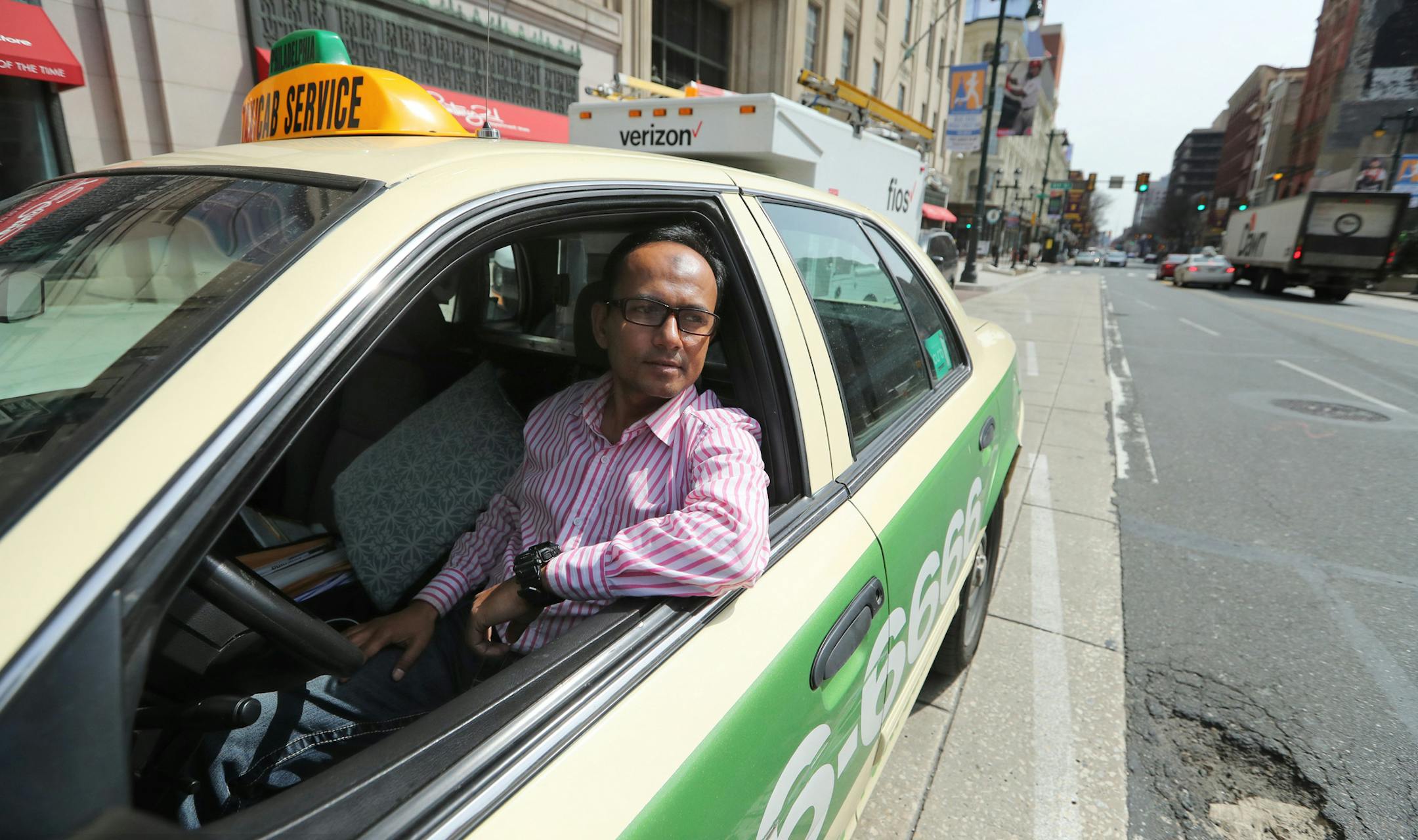 Shah Golamkade, a cab driver who switched to Uber and back to cab driving, sits parked at 8th and Market Streets Monday April 9, 2018 in Philadelphia. (David Swanson/Philadelphia Inquirer/TNS)