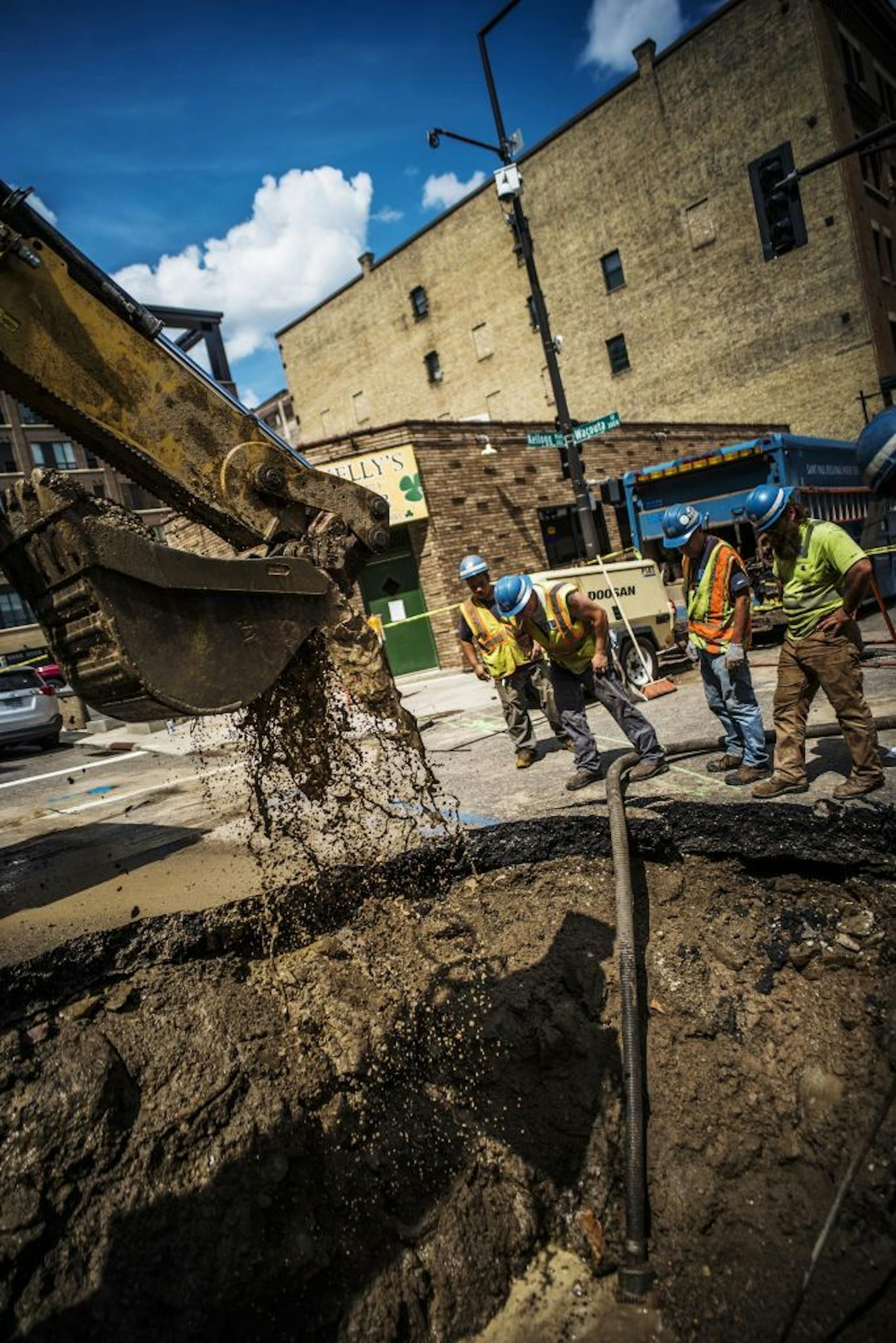 A sinkhole caused by a water main break developed in front of Kelly's Pub in downtown St. Paul. St. Paul Regional Water Services was hard at work prepping the site for repairs.