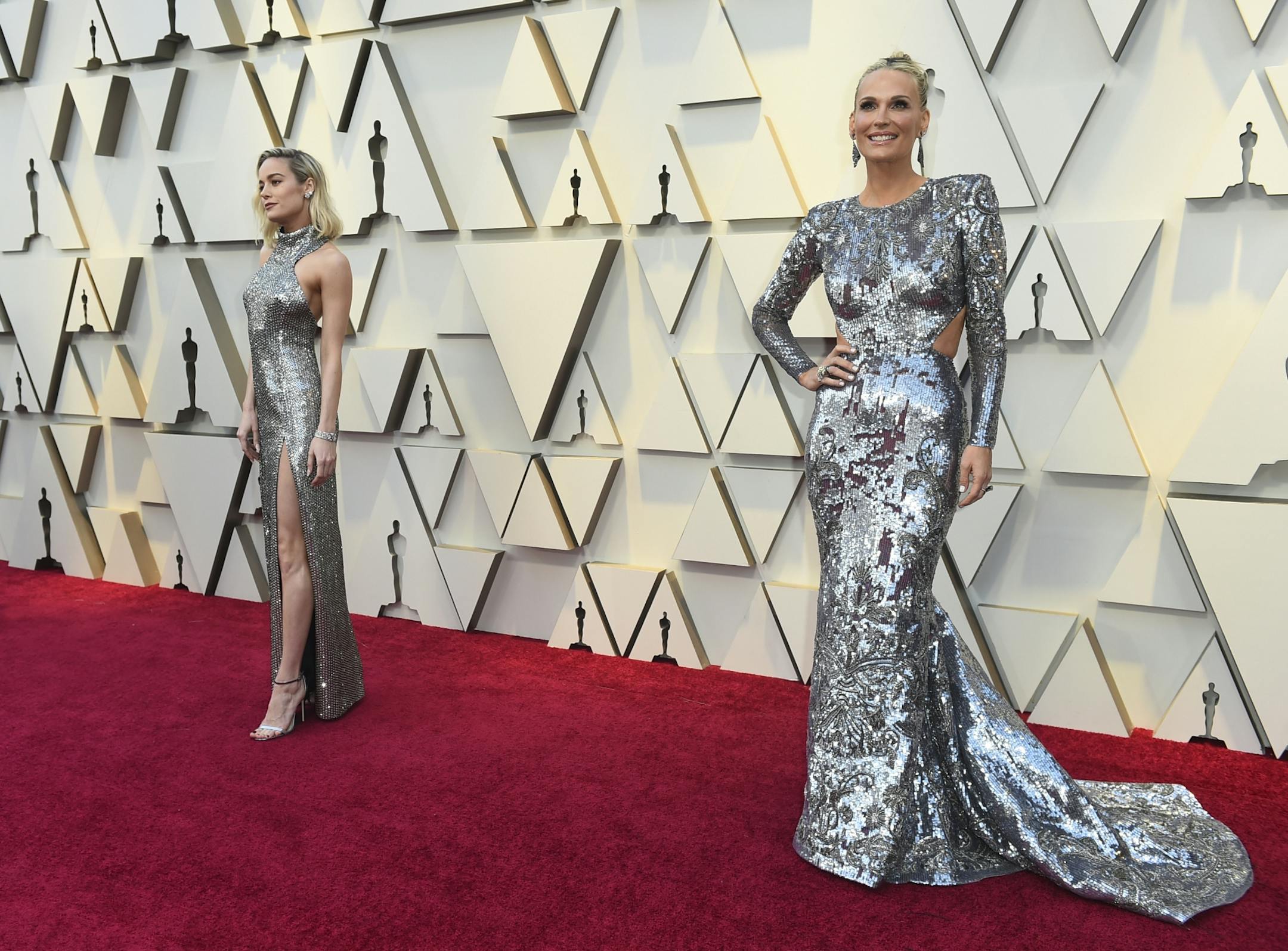 Brie Larson, left, and Molly Sims arrive at the Oscars on Sunday, Feb. 24, 2019, at the Dolby Theatre in Los Angeles.