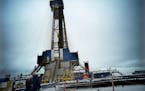 An oil rig digs three wells in 2017 in North Dakota. (RICHARD TSONG-TAATARII/Star Tribune staff photo)