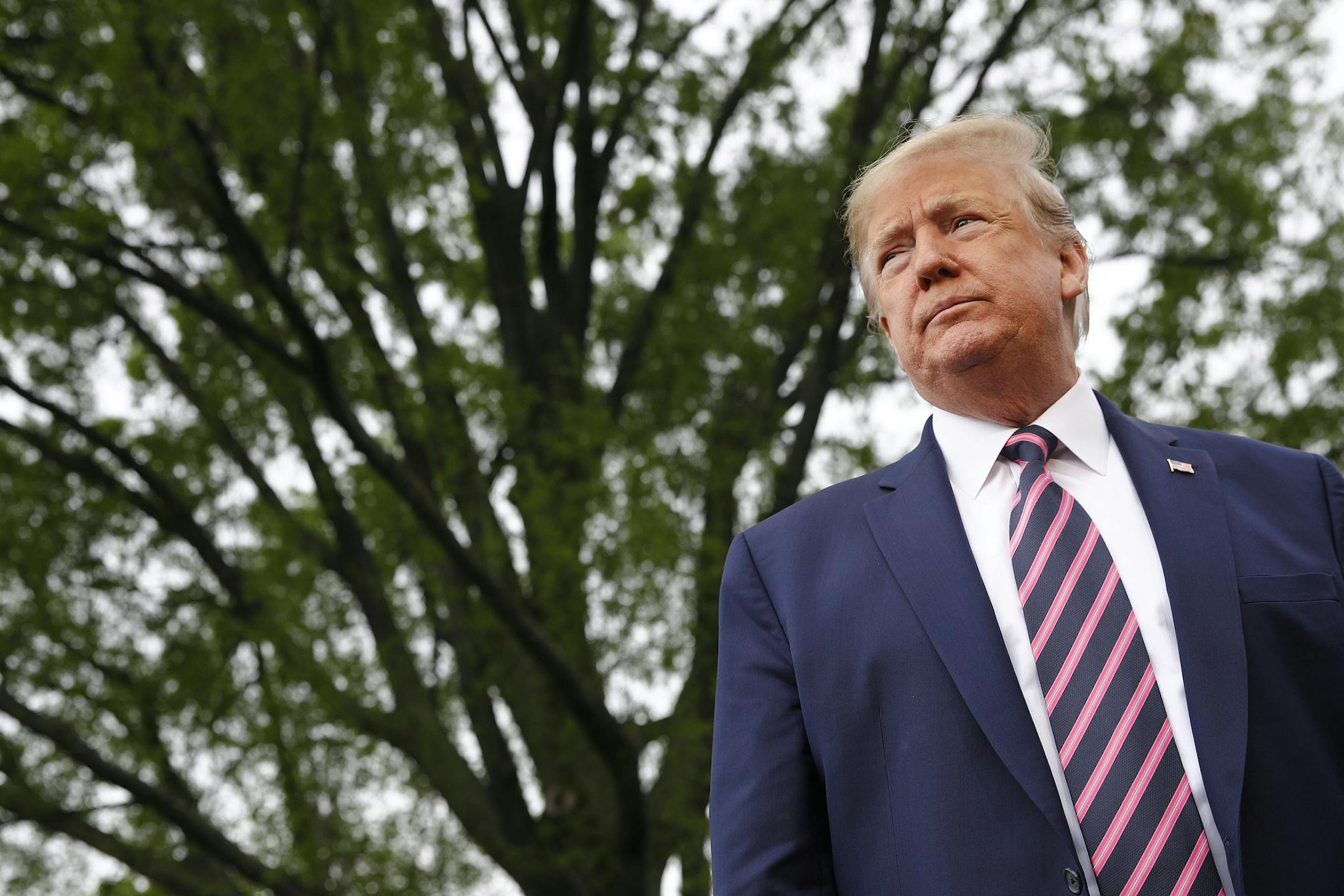 President Donald Trump speaks to members of the media on the South Lawn of the White House in Washington, Tuesday, May 5, 2020, before boarding Marine One for a short trip to Andrews Air Force Base, Md., and then on to Phoenix, Ariz. (AP Photo/Patrick Semansky)