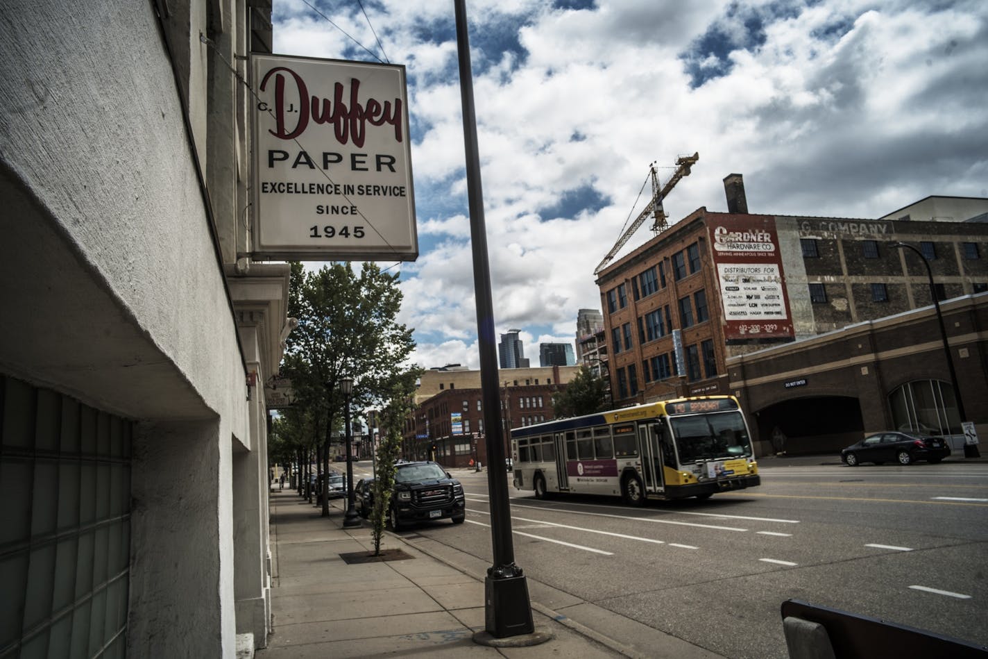 Chicago-based Cedar Street Companies will pay $13 million for three vacant warehouses and a parking lot that once housed the Duffey Paper company. It plans to turn those buildings, which are perched along North Washington Avenue between Fifth and Sixth Avenues in the former block in the former Warehouse District, into about 200 rental apartments and 20,000 square feet of retail space called Duffey Lofts. ORG XMIT: MIN1807261618215268