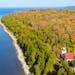 An aerial view of Eagle Bluff Lighthouse during the fall season in Peninsula State Park.