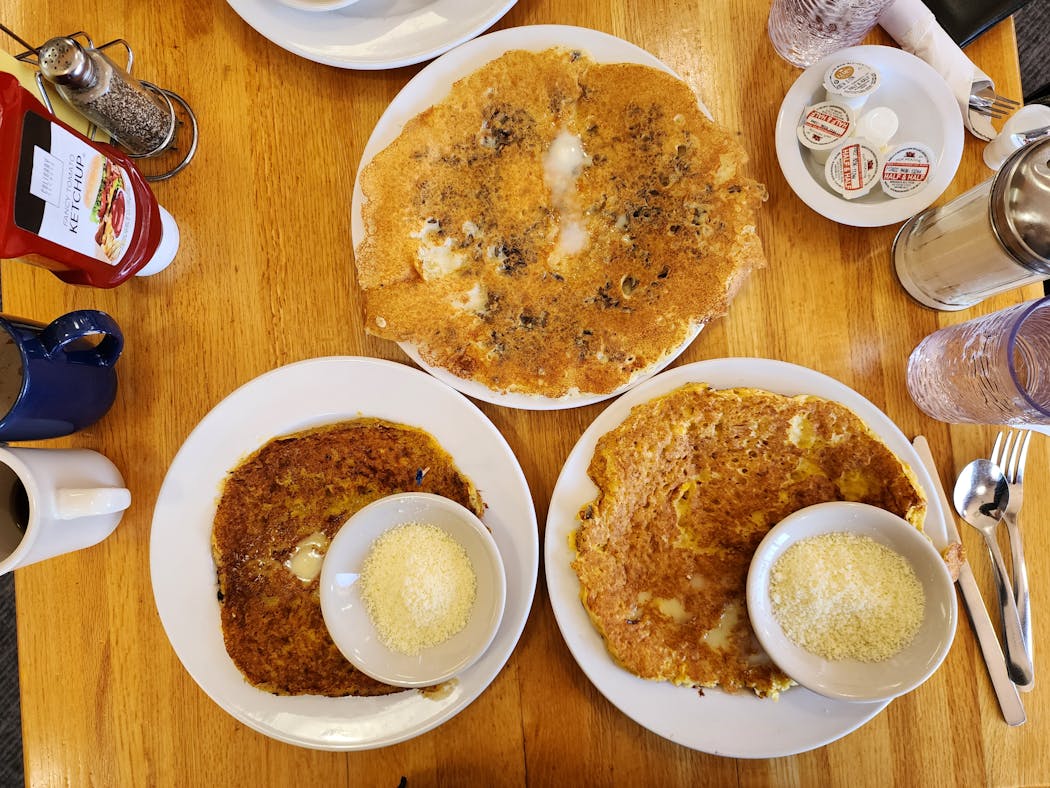 A selection of pancakes from Maria's Cafe in Minneapolis, including the cachapas (corn pancake), bottom right.