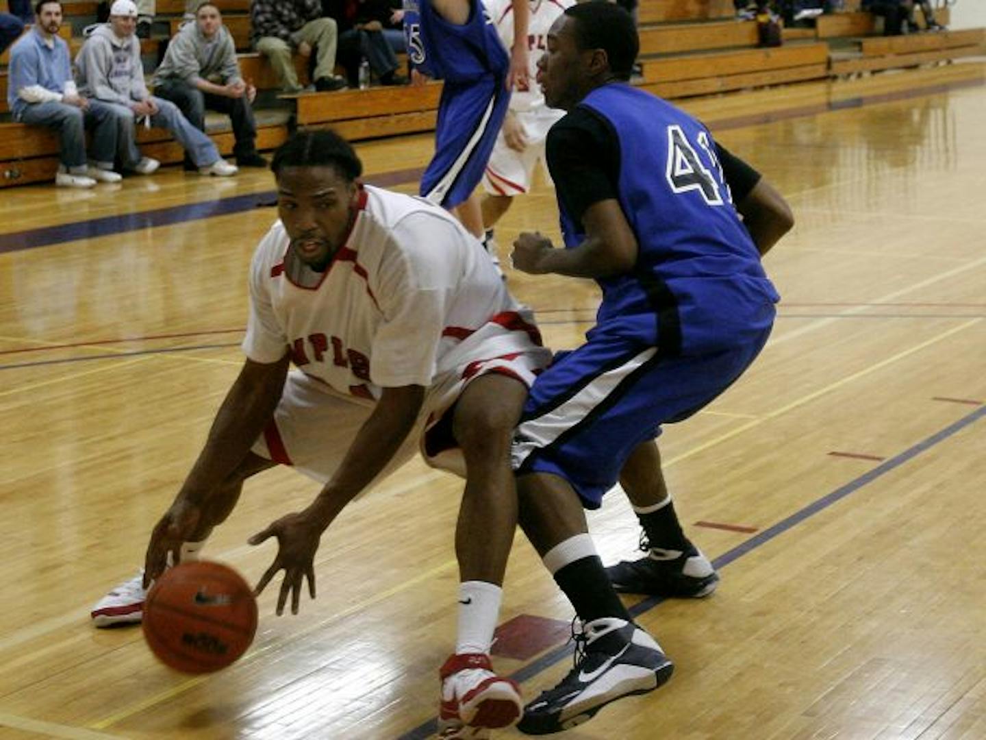 Cortez Wallace (left) played for MCTC in 2009. He never played high school basketball and attended the school after getting his GED.