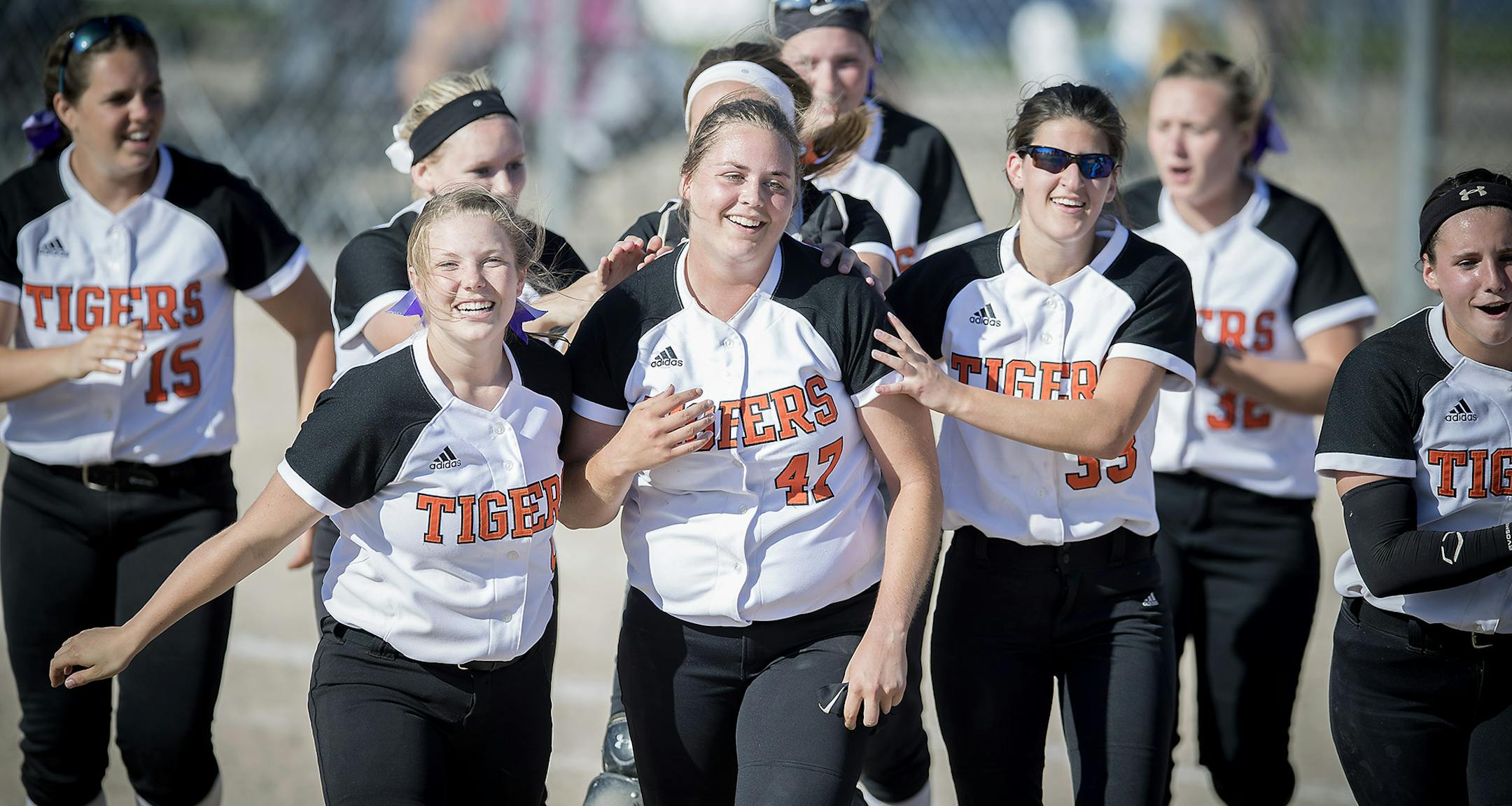 Farmington's Maddie Muelken, center, ran off the field after defeating Chanhassen 2-0 in the Girls softball state tournament at Caswell Park, Thursday, June 8, 2017 in North Mankato, MN. ] ELIZABETH FLORES ï liz.flores@startribune.com