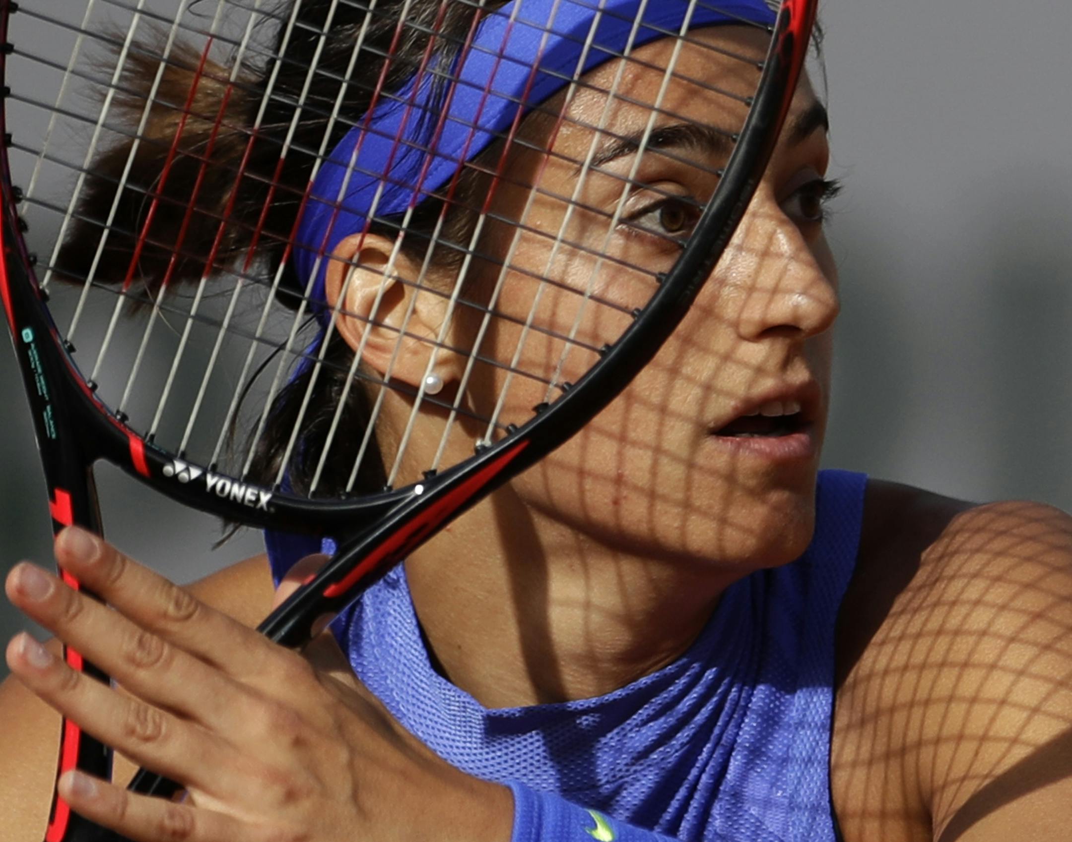France's Caroline Garcia prepares to return a shot against France's Alize Cornet during their fourth round match of the French Open tennis tournament at the Roland Garros stadium, in Paris, France. Monday, June 5, 2017. (AP Photo/Petr David Josek)