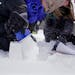 Fifth-grader Shaylee, 11, in Monticello’s nature-based program builds a snow structure while working on a coding project with her classmates Thursda