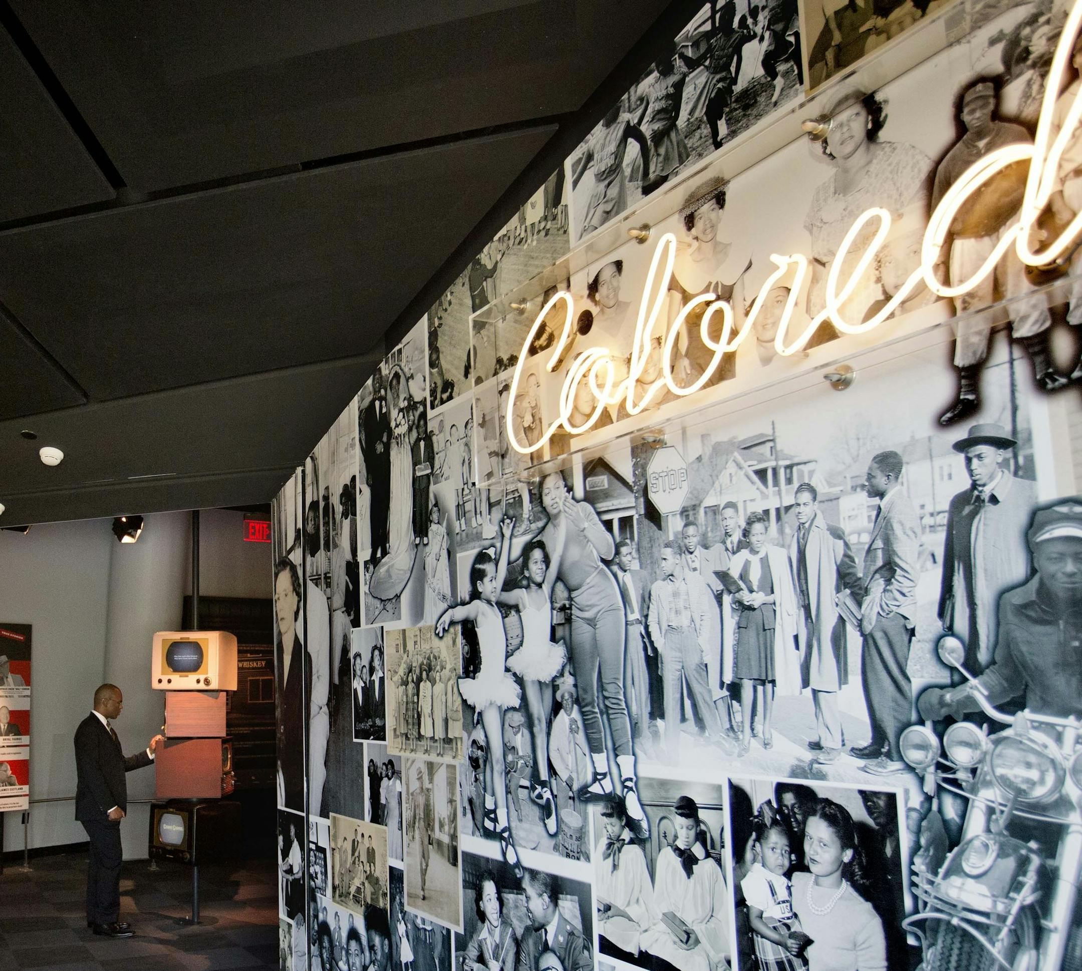 In this June 16, 2014 photo, an exhibit depicting life in America during the 1950s and 60s for whites on the left and blacks on the right greets visitors to the newly built National Center for Civil and Human Rights in Atlanta. The new museum about the history of civil rights opens next week in Atlanta, the city where Martin Luther King Jr. was based. But the National Center for Civil and Human Rights also explores other human rights struggles, from womenís rights and LGBT issues to immigra