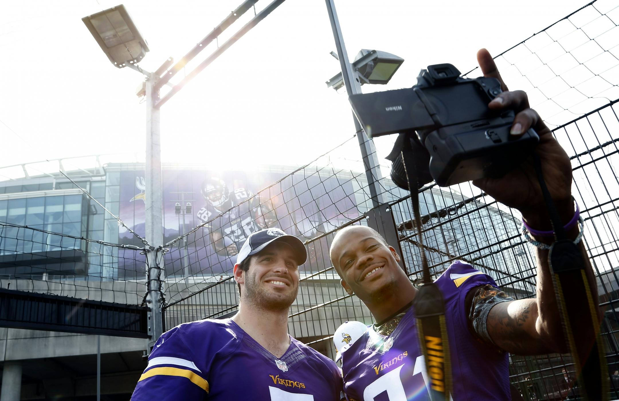 Minnesota Vikings receiver Jerome Simpson (81) took a picture with quarterback Christian Ponder (7) outside of Wembley Stadium shortly after the team arrived in London for Sunday's game vs. the Pittsburgh Steelers.