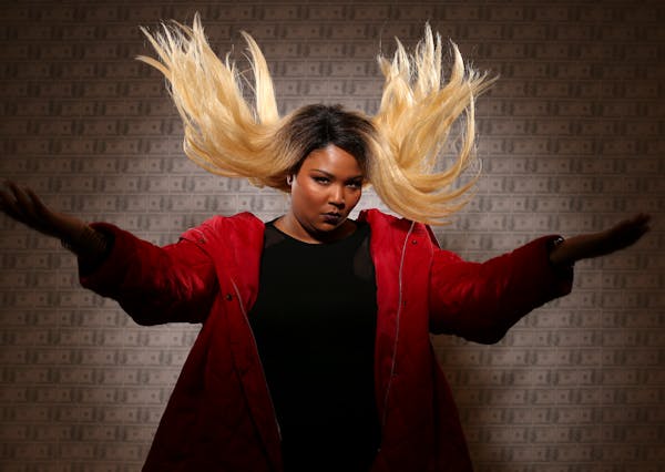 Lizzo, photographed at the Minneapolis College of Art and Design before a recent Grrrl Prty show. The wallpaper backdrop is a student piece in the gal