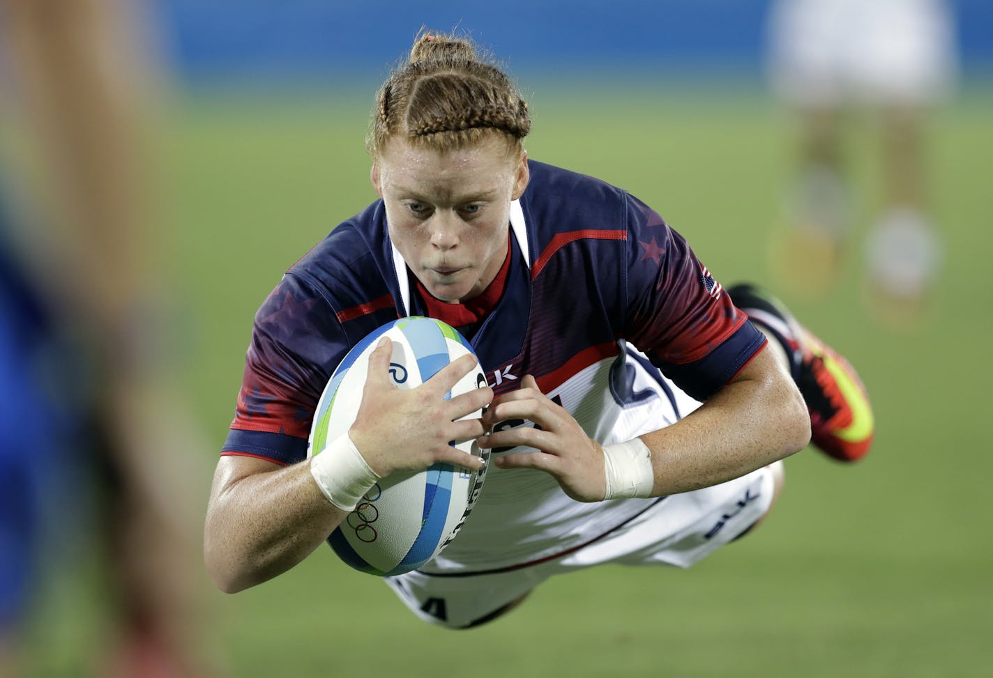 USA's Alev Kelter, scores a try during the women's rugby sevens match between USA and Colombia at the Summer Olympics in Rio de Janeiro, Brazil, Saturday, Aug. 6, 2016. (AP Photo/Themba Hadebe)