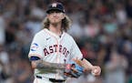 Astros relief pitcher Josh Hader walks near the mound as the Mariners' Cal Raleigh runs the bases after hitting a go-ahead solo home run during the ni
