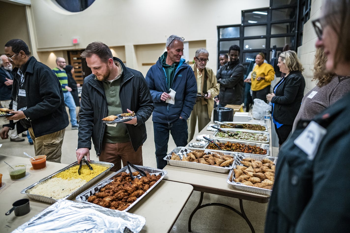 Vanessa Haight, the executive director of Elliot Park Neighborhood Inc., hosts a dinner for stakeholders on how to solve a food desert problem.