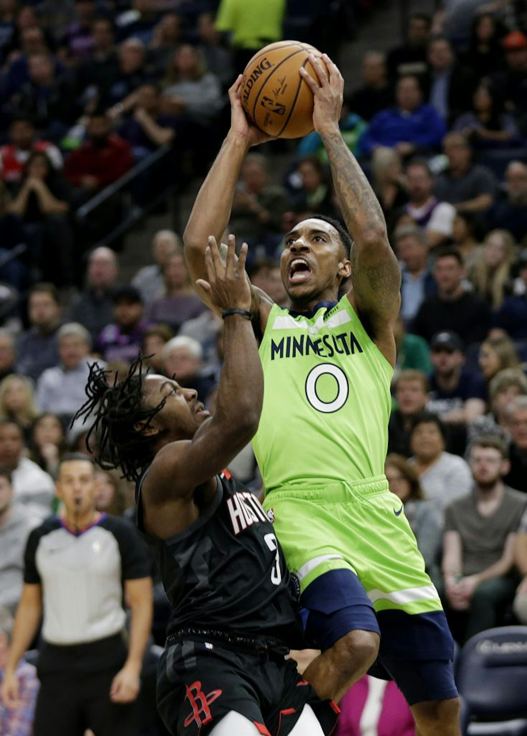 Minnesota Timberwolves guard Jeff Teague (0) shoots against Houston Rockets guard Chris Clemons (3) in the first quarter during an NBA basketball game Saturday, Nov. 16, 2019 in Minneapolis.