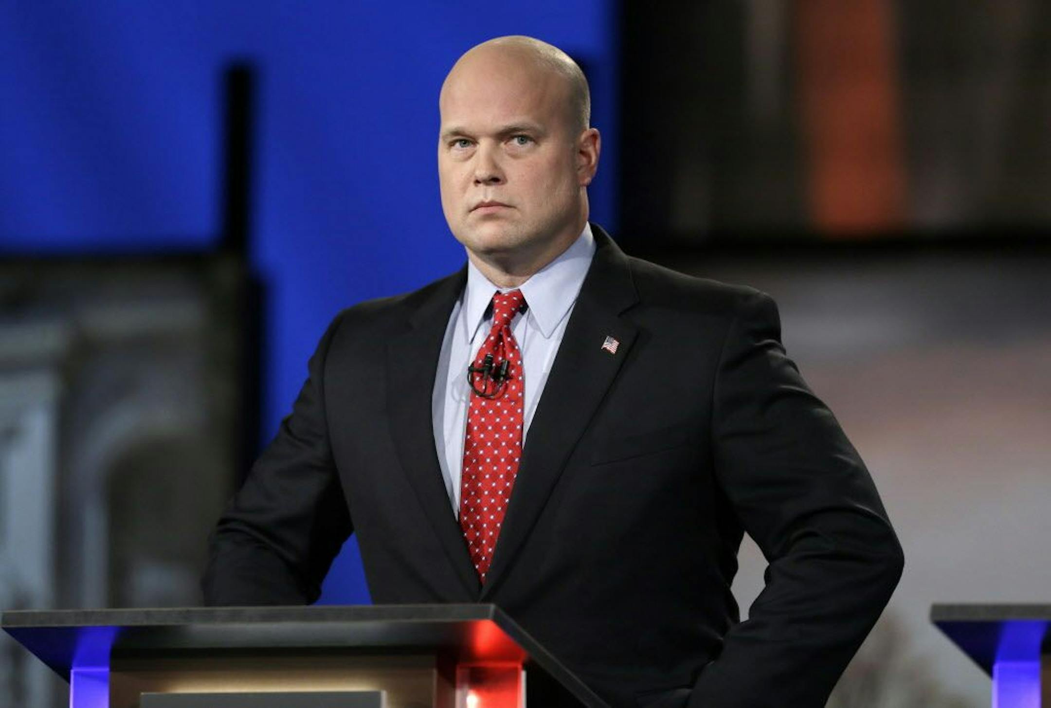 FILE - In this April 24, 2014, file photo, then-Iowa Republican senatorial candidate and former U.S. Attorney Matt Whitaker watches before a live televised debate in Johnston, Iowa. President Donald Trump announced in a tweet that he was naming Whitaker, as acting attorney general, after Attorney General Jeff Sessions was pushed out Nov. 7, 2018, as the country's chief law enforcement officer after enduring more than a year of blistering and personal attacks from Trump over his recusal from the