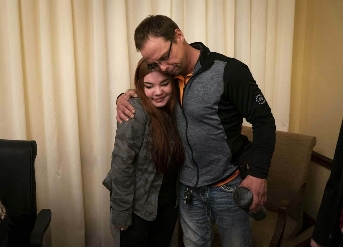 Hannah Traaseth hugged her father Brad Traaseth after testifying about her rape during a hearing at the State Capitol in St. Paul, Minn., on Wednesday, March 13, 2019.