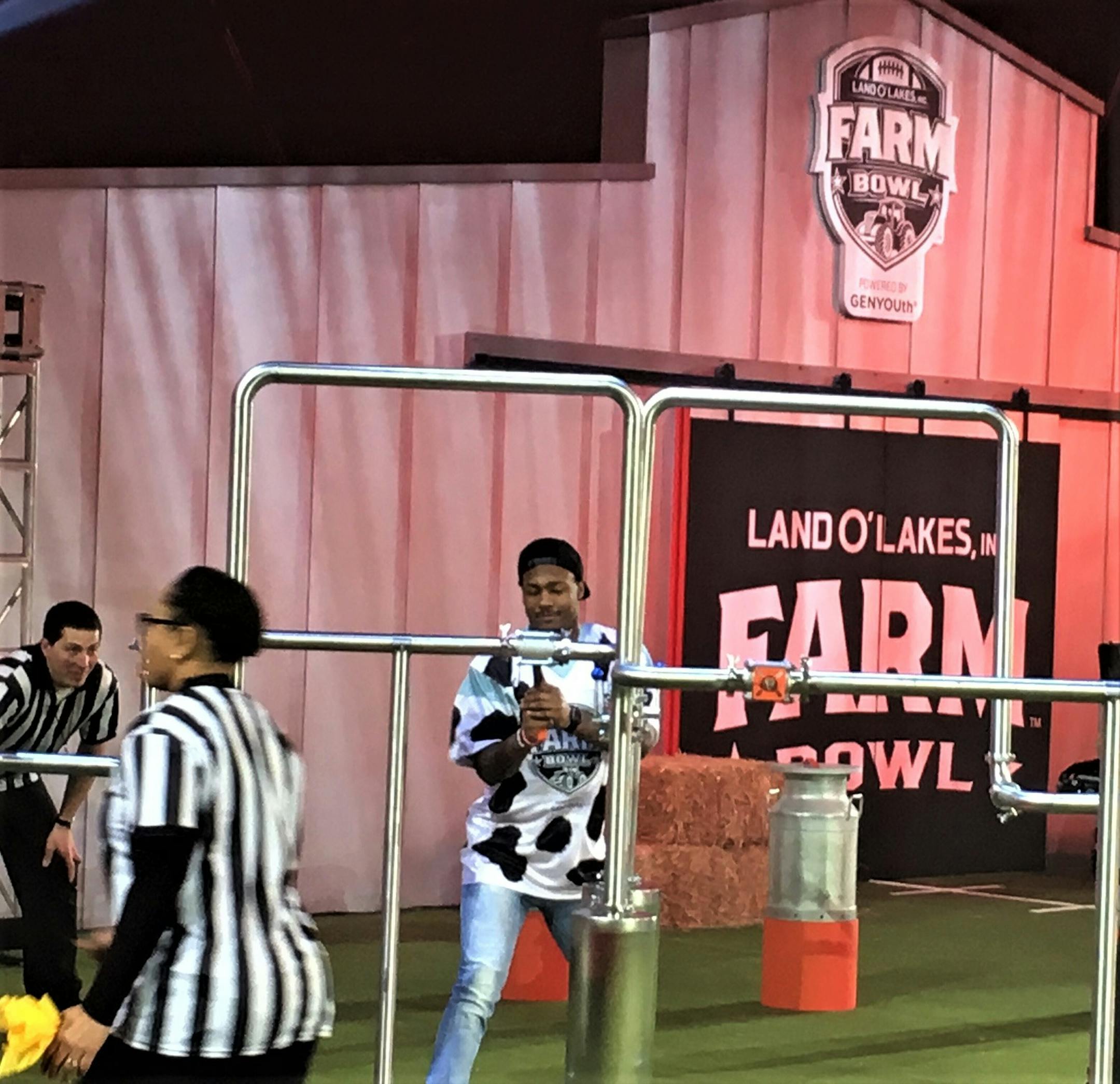 Minnesota Vikings wide receiver Stefon Diggs races the clock to complete farm tasks during Thursday's Land O’Lakes Farm Bowl inside 3M Arena at Mariucci. Diggs and his teammate, J.J. Nunes, a farmer from Tulare, Calif., won the competition.