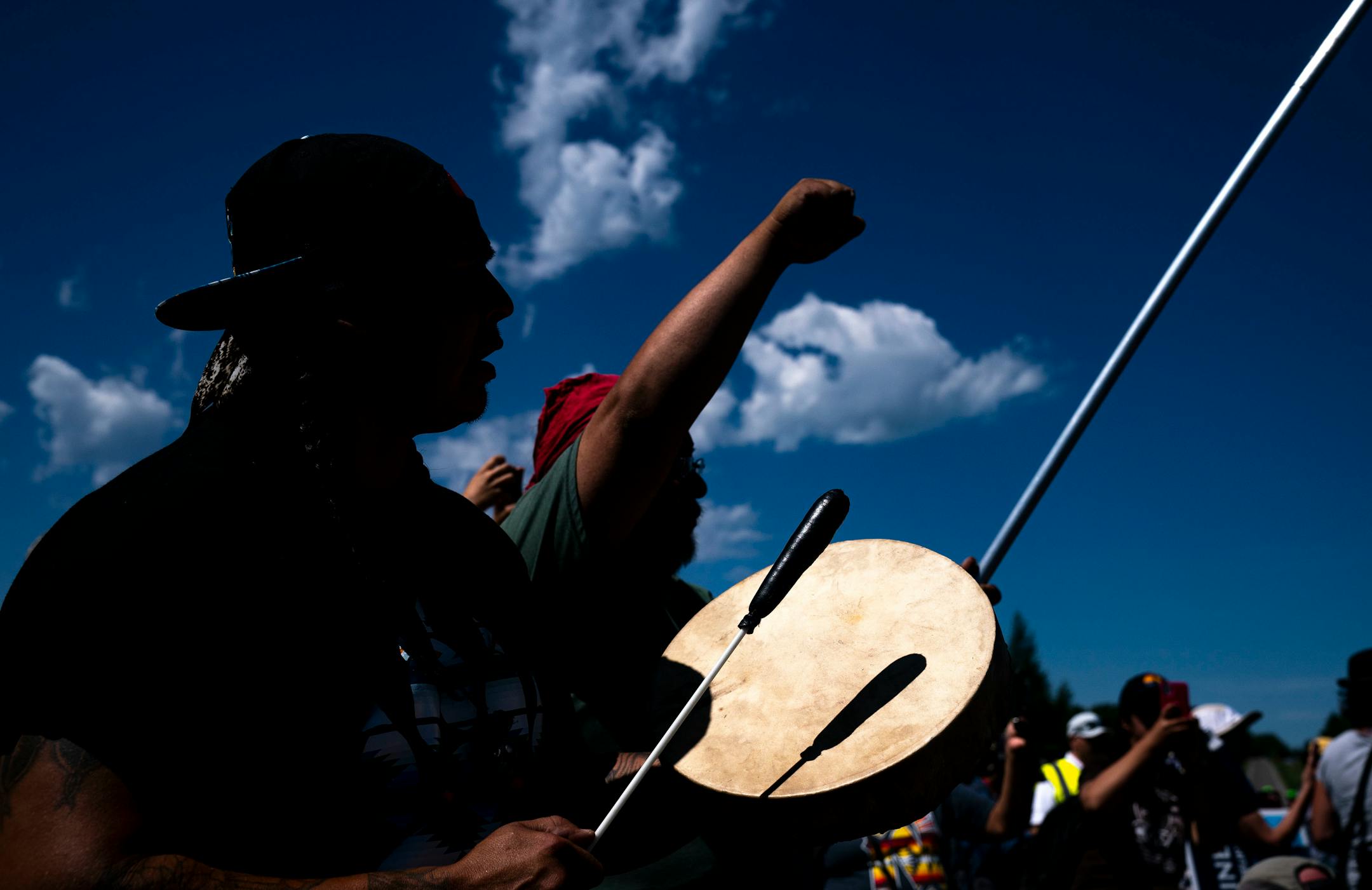 Roy Broncheau aka Walks Through Hail played the drum and sang during the march on Monday.