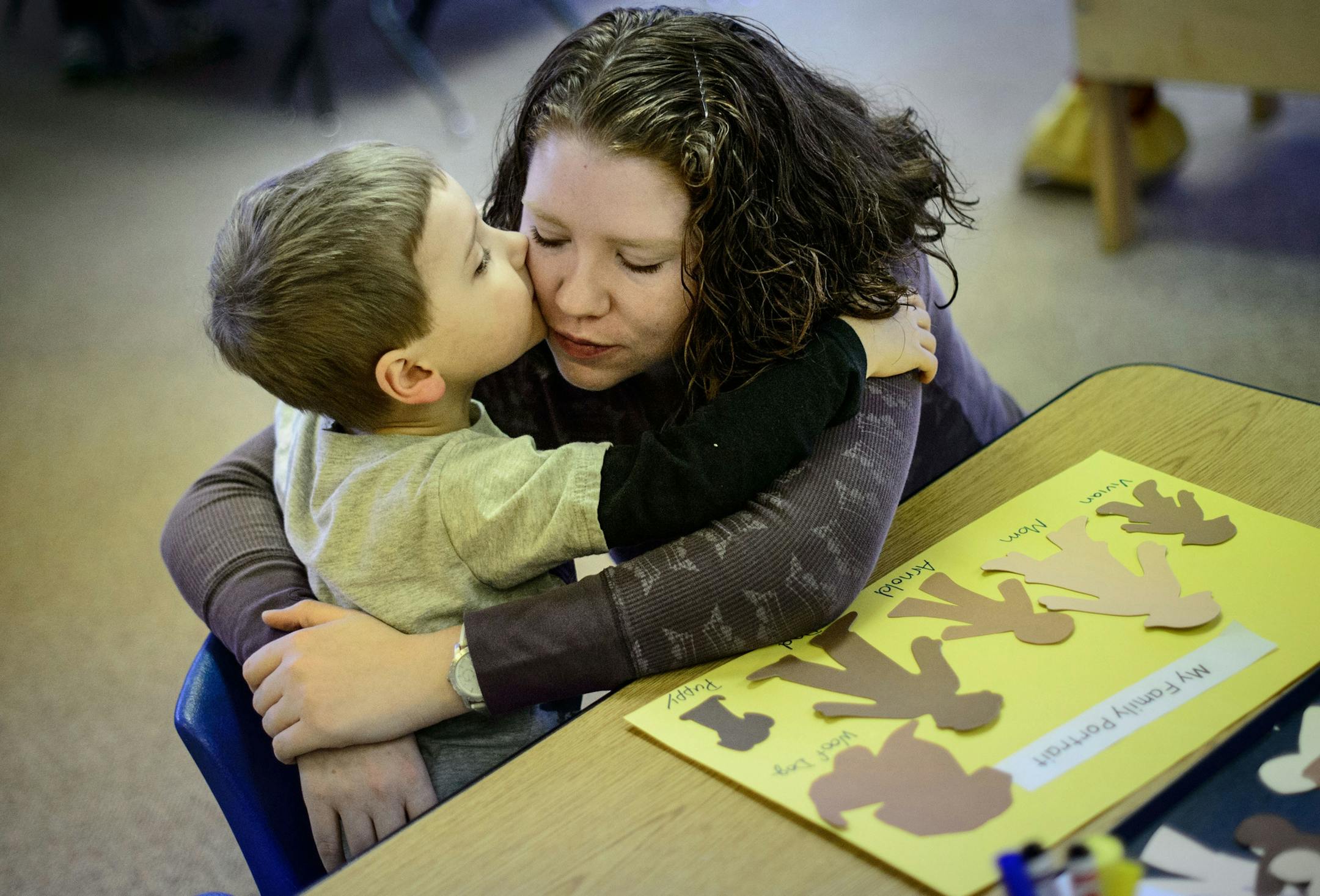Arnold Sweet, 4, kissed his mom Rachel goodbye after they worked together on a family portrait. Rachel and other moms at the adult education and early childhood center then headed to a class on childhood brain development. The plan to relocate the existing District 196 adult education and early childhood center to another location in Apple Valley is causing controversy among residents there. Wednesday, November 20, 2013. ] GLEN STUBBE * gstubbe@startribune.com