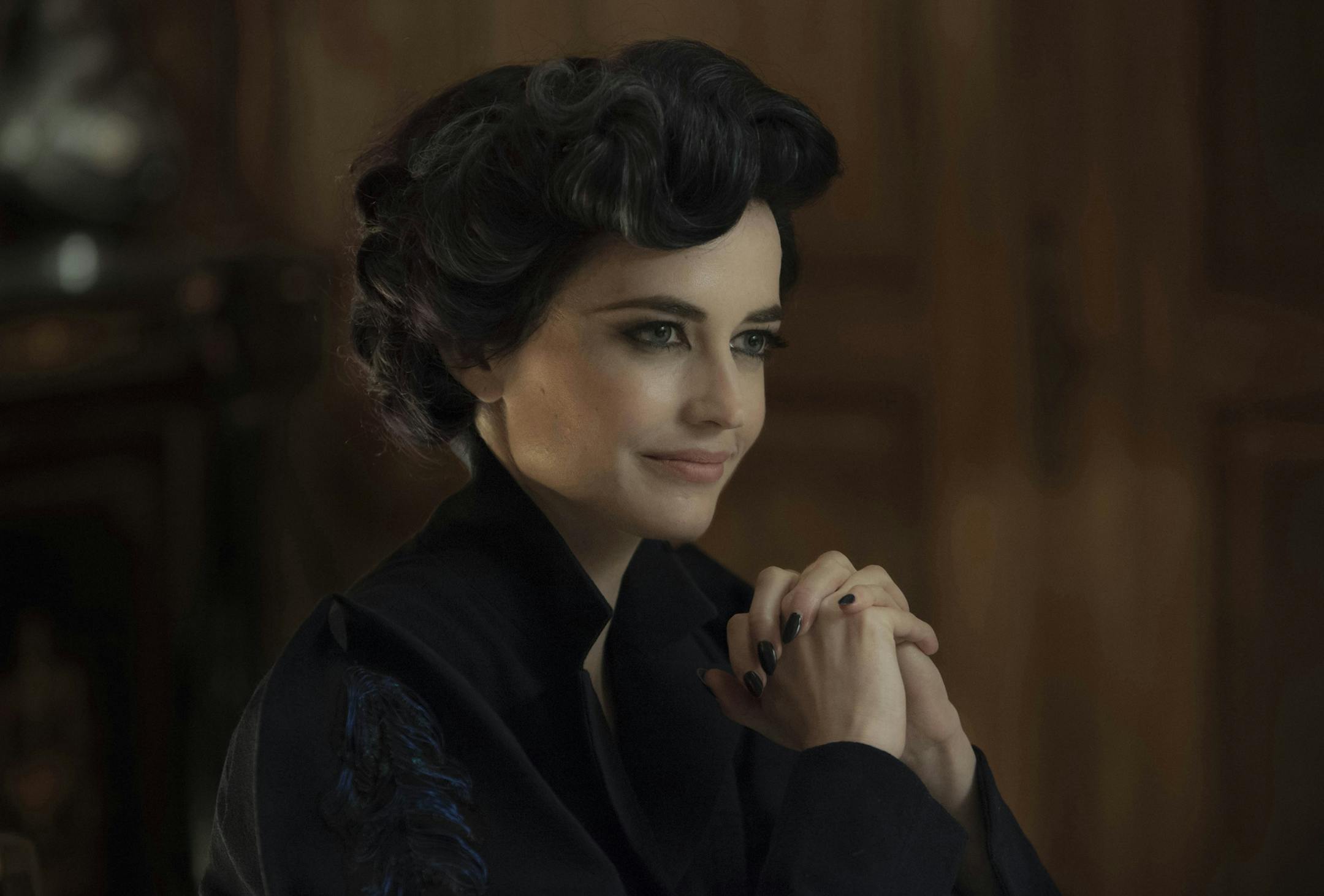 DF-02399crop - Eva Green portrays Miss Peregrine, who oversees a magical place that is threatened by powerful enemies. Photo Credit: Leah Gallo.