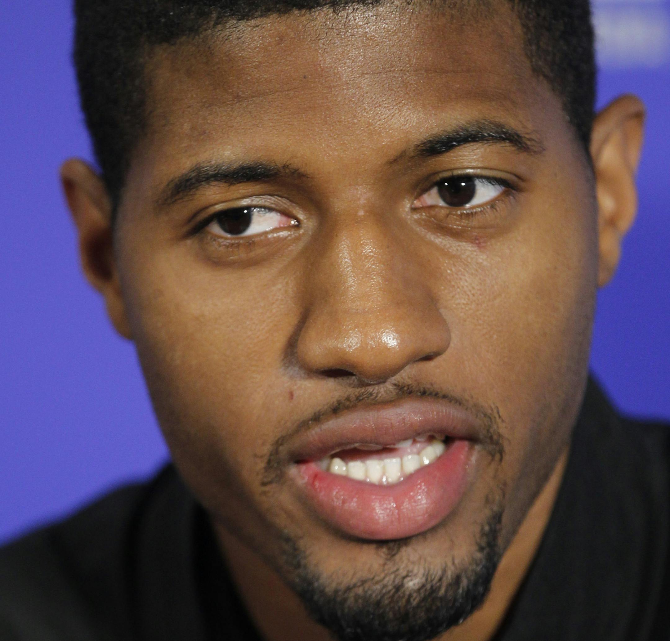 NBA Indiana Pacers Paul George takes questions from media during a press conference in Taipei, Taiwan, Friday, Oct. 11, 2013. In a push for the NBA to expand its brand globally, George and the Pacers will play a preseason game against the Houston Rockets on Sunday, Oct. 13, 2013, in Taipei. (AP Photo/Wally Santana) ORG XMIT: OTK