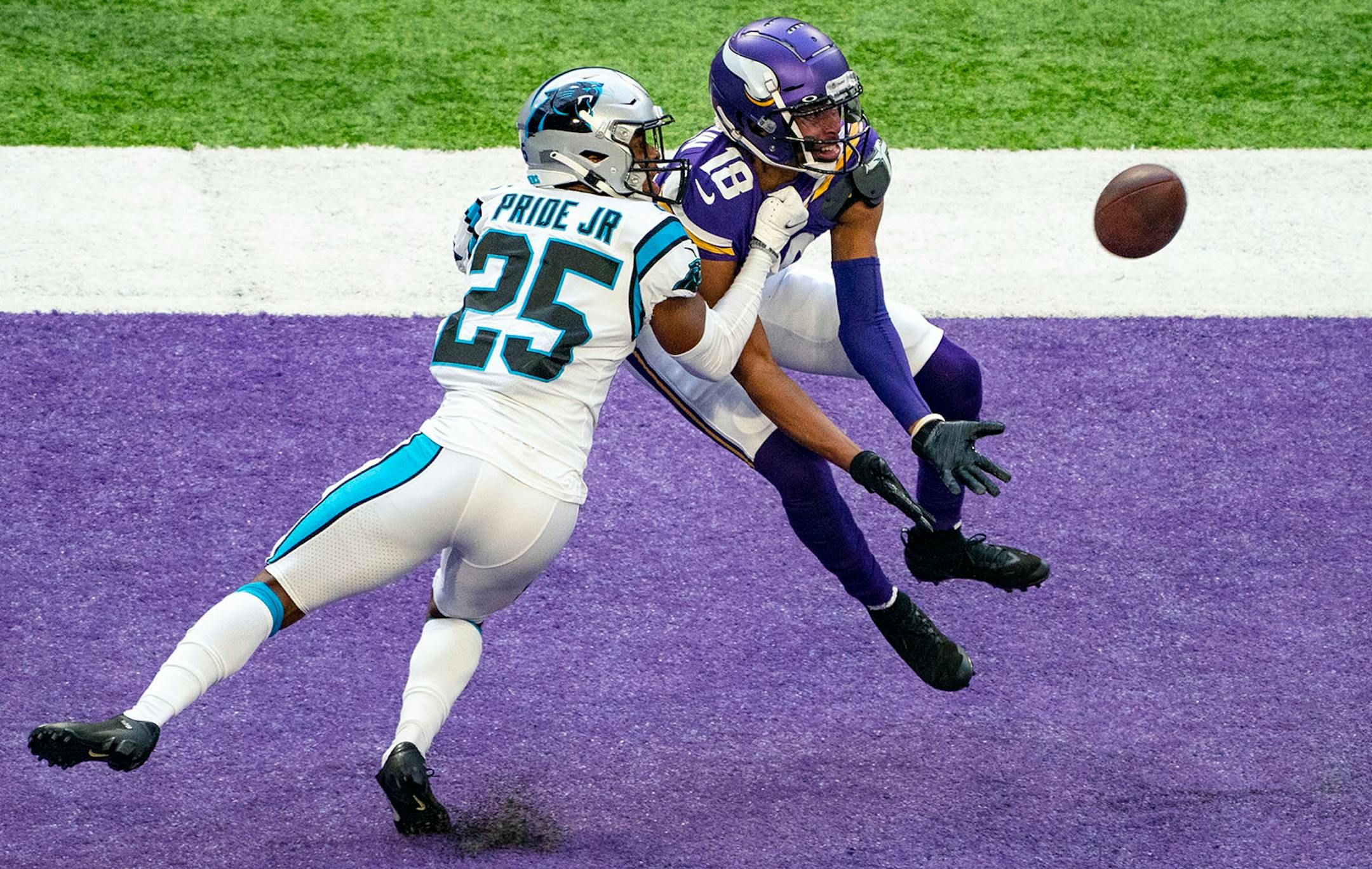 Minnesota Vikings wide receiver Justin Jefferson (18) had a potential touchdown broken up by Carolina Panthers cornerback Troy Pride (25) at the end of the second quarter on Sunday.
