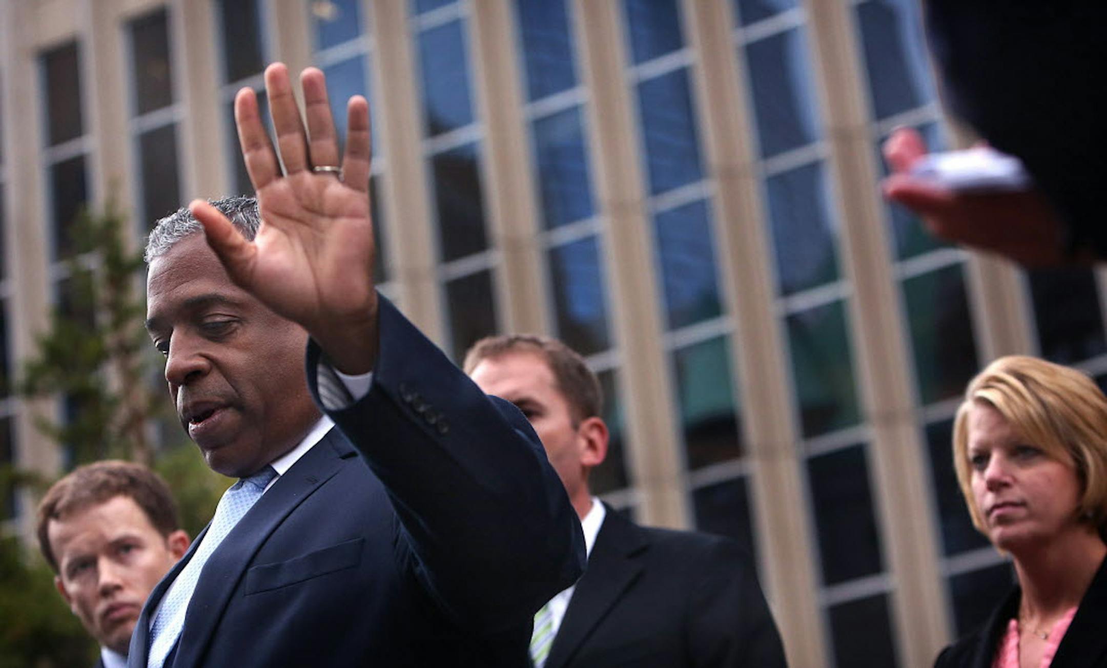 Minnesota U.S. Attorney B. Todd Jones (foreground) and members of the prosecution team addressed members of the media outside the federal courthouse in Minneapolis after Mahamud Said Omar's trial.