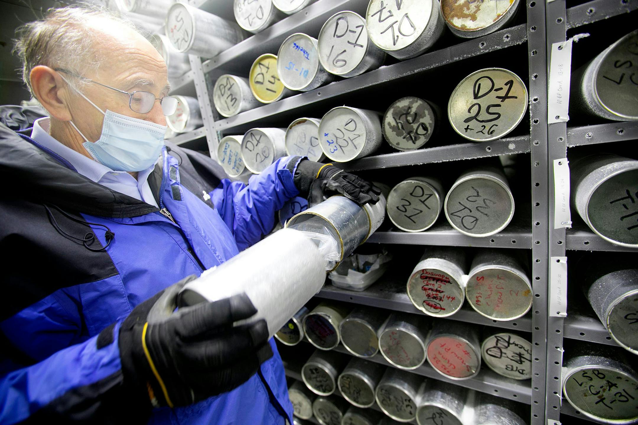 Lonnie Thompson, paleoclimatologist at the Byrd Polar Climate and Research Center at Ohio State University, examines an ice core sample from the center's massive collection. (Courtney Hergesheimer/Columbus Dispatch/TNS) ORG XMIT: 1829075