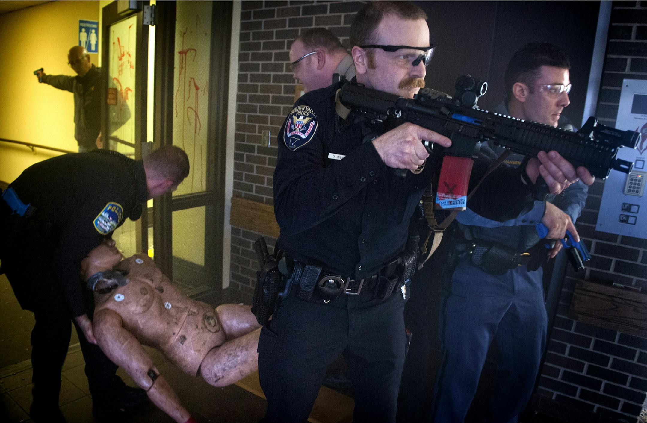 During a training drill last week in a vacant St. Paul building, officers provided cover for rescue personnel as they removed a victim from a smoke-filled room.