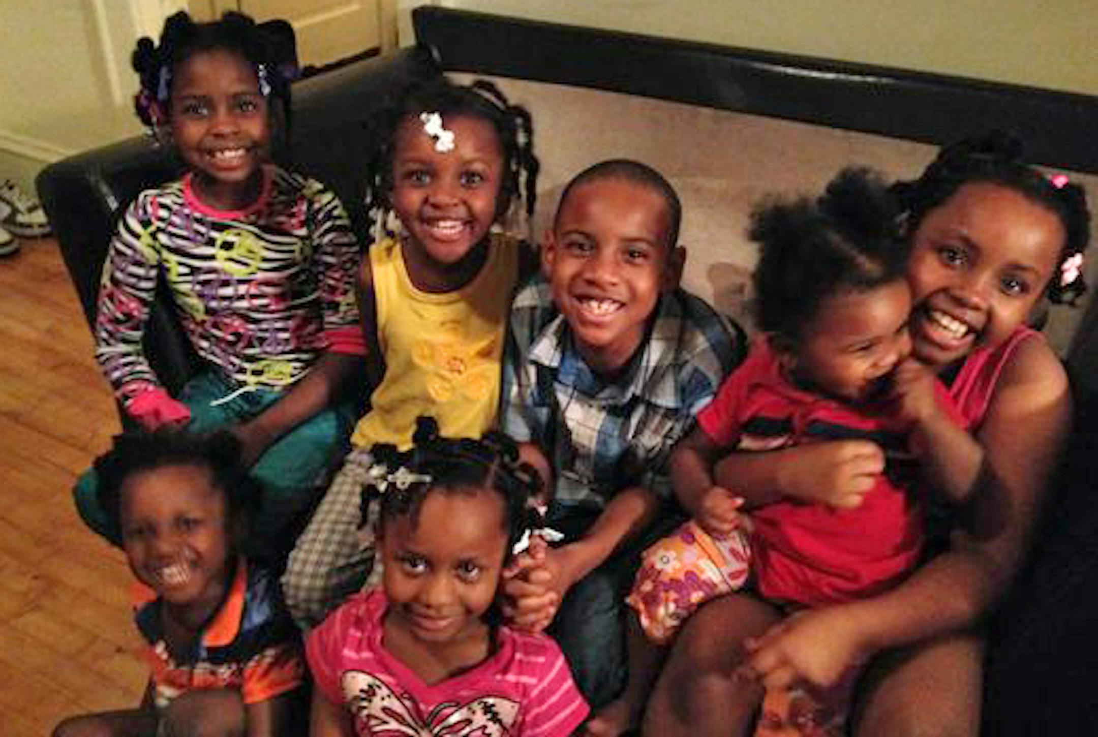 CAPTION: The Lewis family children. In front: Troy, left, and Electra. In back from left: Mary, Fannie, Christopher, Gwendolyn and Shaca. Only Electra and Shaca among the Lewis children survived the fire. CREDIT: Provided by the Lewis family