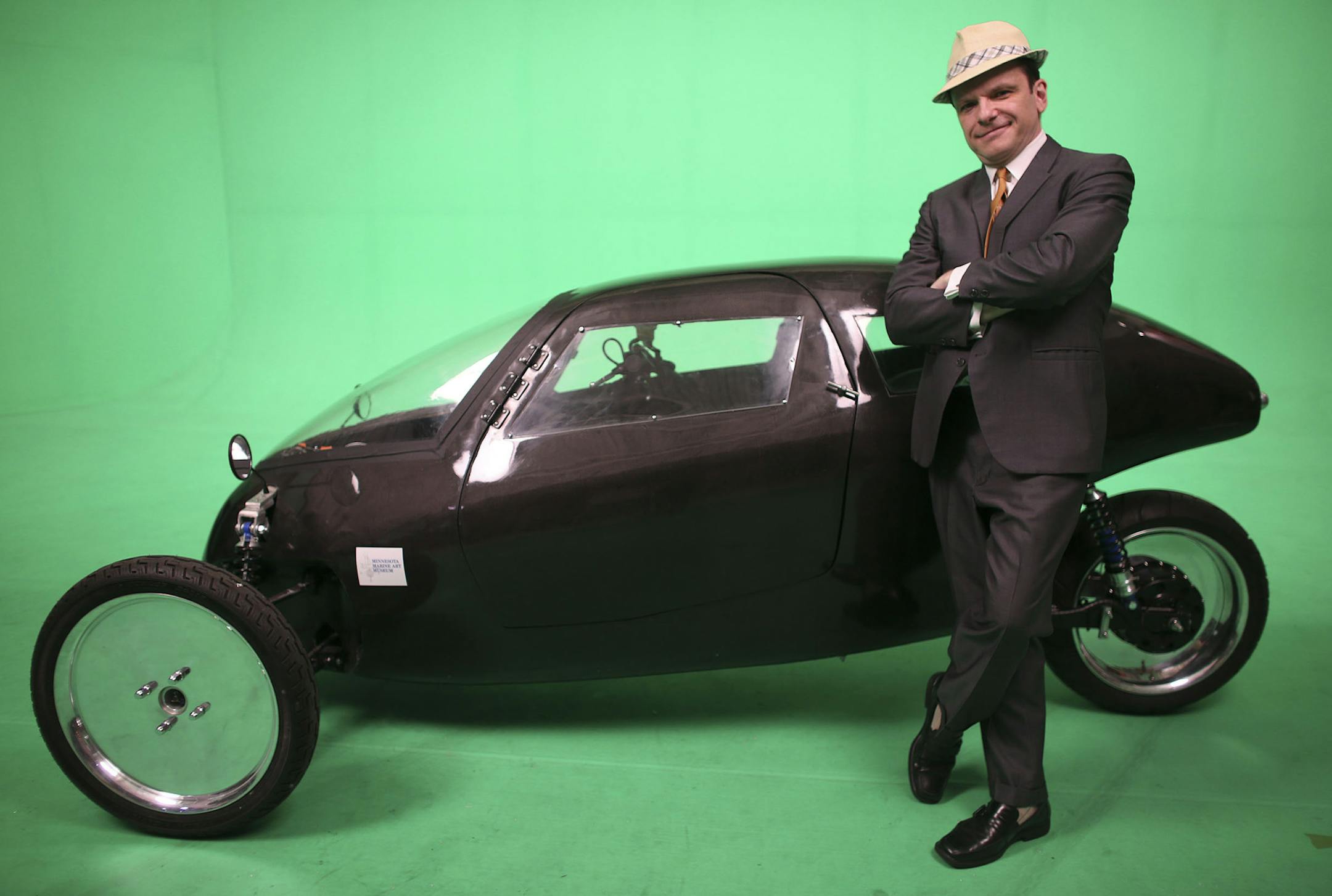 Rich Kronfeld, of Golden Valley, stood in front the Rahtmobile, an abbreviation of Recumbent Automotive Human Transport, that electric-powered, enclosed tricycle whose batteries can be recharged by pedaling at a television studio in St. Paul, Min., Tuesday, June 11, 2013. Kronfeld, the main developer, said that the Rahtmobile goes at least 45 miles per hour, and seems like a cross between a motorcycle and a car ] (KYNDELL HARKNESS/STAR TRIBUNE) kyndell.harkness@startribune.com