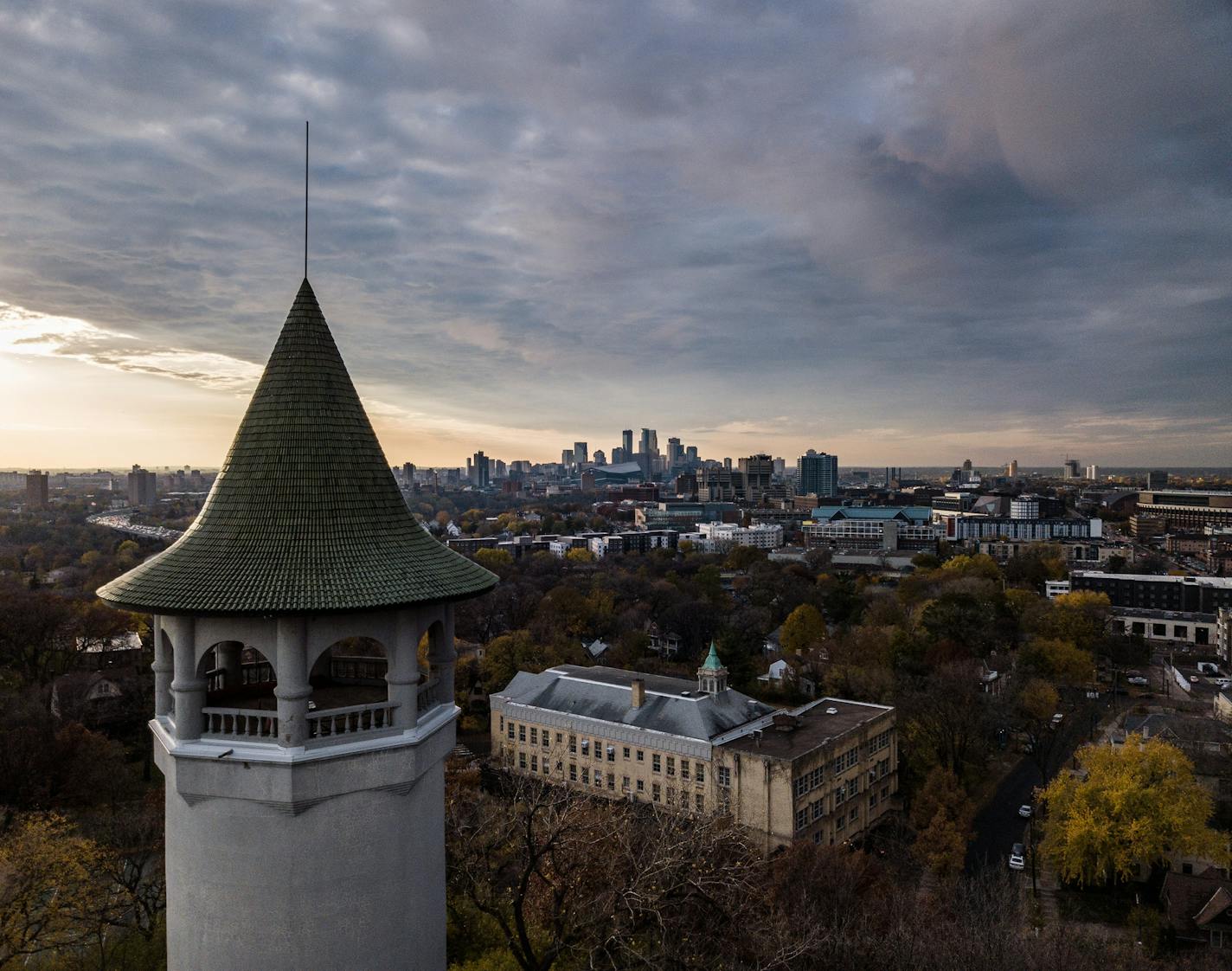 ] MARK VANCLEAVE &#x2022; mark.vancleave@startribune.com * Dark clouds give way to a last gasp of sun over Minneapolis on Monday, Oct. 29, 2018.
The 110-foot Witch&#x2019;s Hat water tower, open to visitors once a year, offers a panoramic view of the Twin Cities. A neighborhood group alleges that a condominium planned nearby will ruin that view.