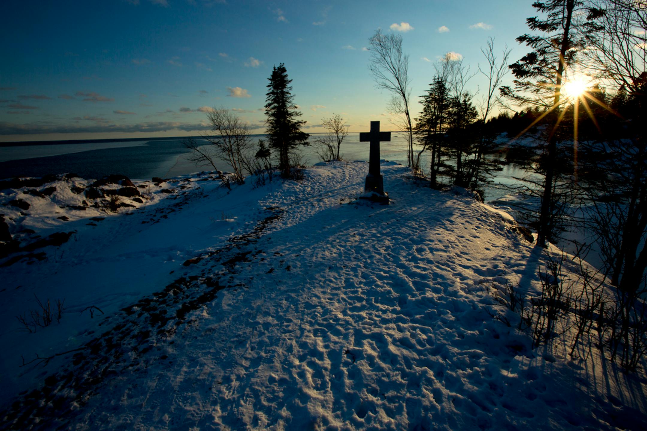 Starting in 1831, Father Frederic Baraga, a Slovenian priest spent a long and frenetic life canoeing and snowshoeing between Ojibwe settlements in Sault Ste. Marie Michigan, Grand Portage, and LaPointe on Madeline Island. A memorial cross stands on a small point along the Cross River as it enters Lake Superior. ] Minnesota -State of Wonders, Arrowhead in Winter BRIAN PETERSON • brian.peterson@startribune.com
Cross River, MN 2/14/2014