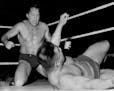Verne Gagne, left, competes against Kinji Shibuya during a wrestling match at the Minneapolis Auditorium in 1954.