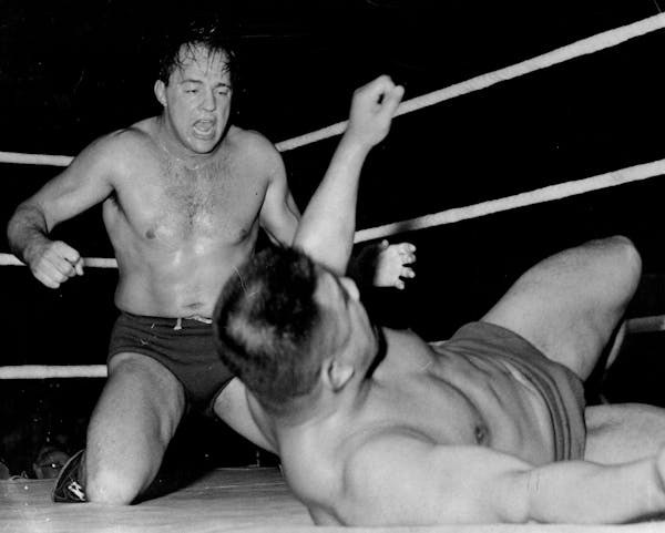 Verne Gagne, left, competes against Kinji Shibuya during a wrestling match at the Minneapolis Auditorium in 1954. 