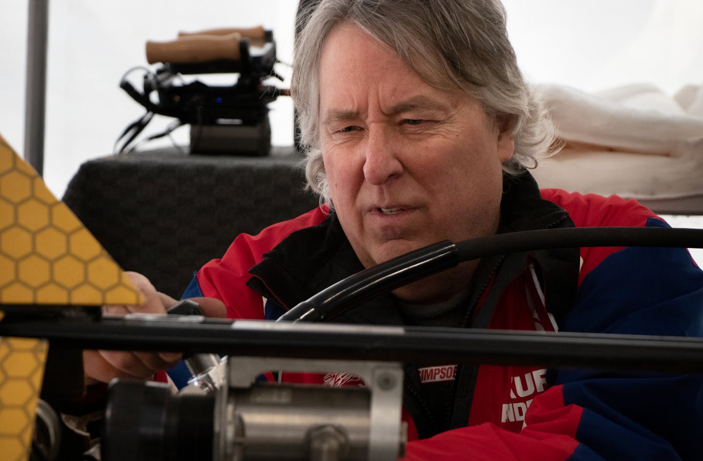 Kurt Anderson made final adjustments to the Arctic Arrow before its first run at Bear Lake in Manawa, Wis.