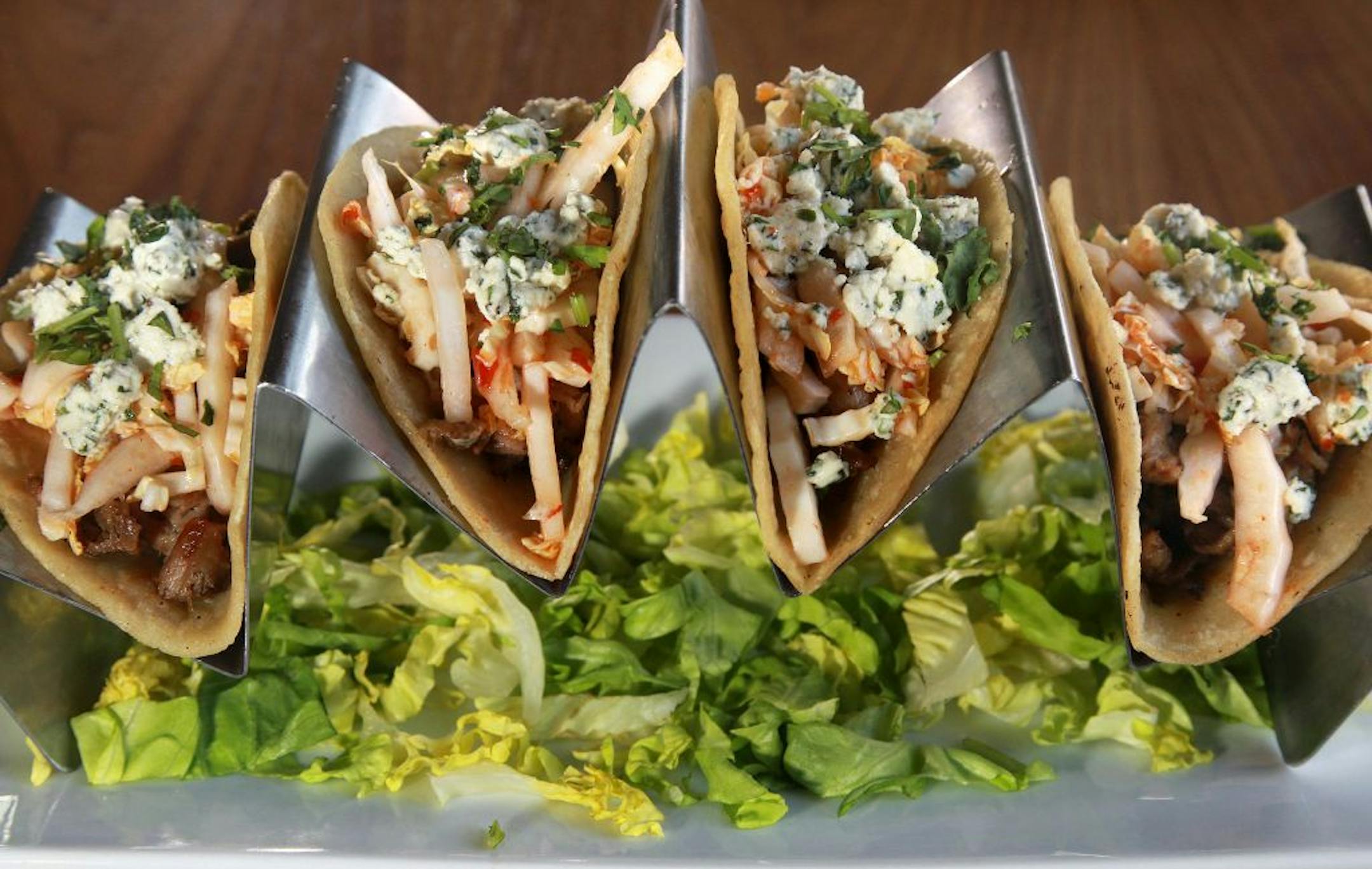 Duck Confit Tacos. _ Restaurant review of Primebar. Lots of choices of Great locally brewed beers on the taps. The food: Deviled eggs, Pulled Pork sliders, Duck Confit tacos, Cobb salad and Inside out Ravioli. [ TOM WALLACE � twallace@startribune.com _ Assignments #20025555A _ Sept 27, 2012_ SLUG: rn1004_ EXTRA INFORMATION: Bartender Michael Long, guest from left to right are Kent Scheff, Steve Skube, Marcel Rivard Teran Ferguson and J.J. Germscheid all of minneapolis. CQ'ed by themselves. Host