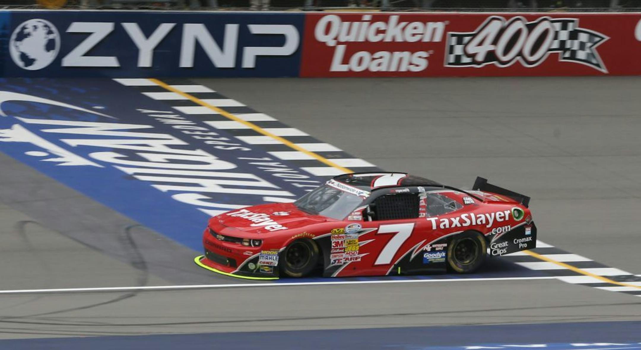 NASCAR Nationwide driver Regan Smith crosses the finish line to win the NASCAR Nationwide series Alliance Truck Parts 250 auto race at Michigan International Speedway, Saturday, June 15, 2013 in Brooklyn, Mich.