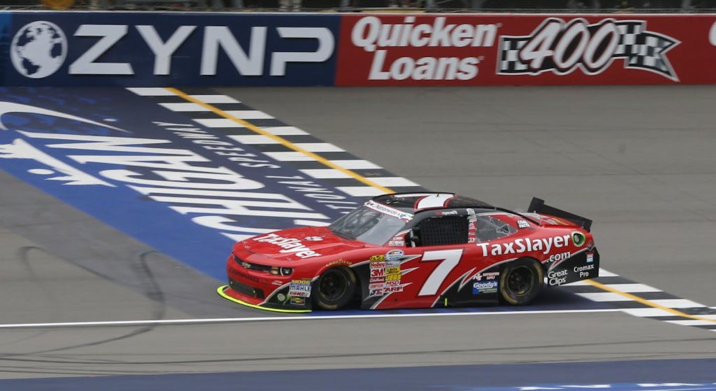 NASCAR Nationwide driver Regan Smith crosses the finish line to win the NASCAR Nationwide series Alliance Truck Parts 250 auto race at Michigan International Speedway, Saturday, June 15, 2013 in Brooklyn, Mich.